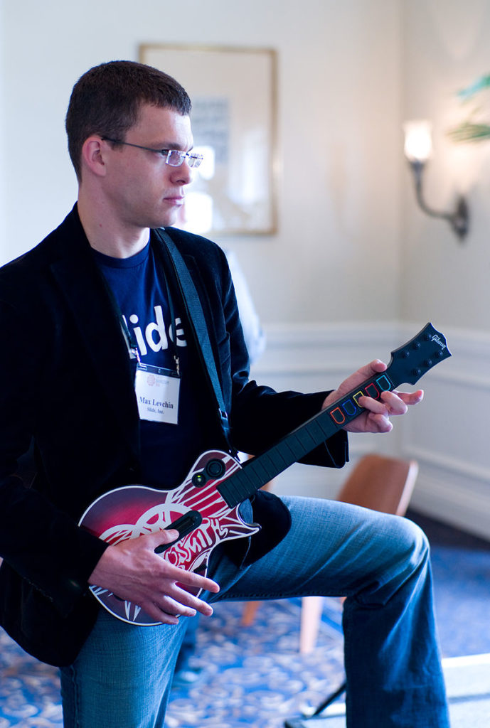 PayPal founder Max Levchin playing Guitar Hero game